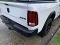 2021 RAM 1500 truck displaying its rear tail lights and bumper with the 4x4 badge visible