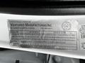 A label on the interior of a 2017 Ford F-550 featuring manufacturer details and safety standards information