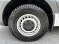 Close-up of a black tire on a silver wheel stamped with the Mercedes-Benz logo and Kumho branding