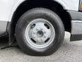 Close-up of a wheel with a silver rim and a Bridgestone tire on a 2020 Chevrolet Express