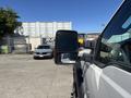 A 2016 Ford F-550 truck with a side mirror visible in the foreground