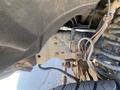 View of the undercarriage of a 2016 Ford F-350 SD showing rusted components and visible suspension parts