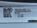A 2004 Freightliner M2 vehicle identification label showing details such as type, manufacturing information, and weight specifications