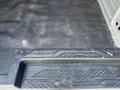 Interior view of a 2016 Ford Transit showing the floor and rubber mat with textured grip along the side step