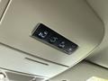 Overhead console control panel of a 2017 Dodge Grand Caravan featuring buttons for lights and power doors
