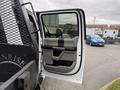A 2020 Ford F-550 with an open door showcasing the interior panel and seating area