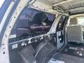 Interior view of a 2013 Ford Expedition showing the stripped-out cabin with no seats and exposed wiring