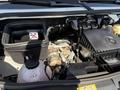Close-up of the engine compartment of a 2023 Mercedes-Benz Sprinter showing components like the air filter and coolant reservoir