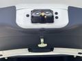 A 2005 Chrysler PT Cruiser with its rear hatch open showing the interior latch and wiring components