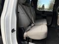 Interior view of the back seat of a 2017 Ford F-450 Super Duty featuring gray fabric seats with seat belts
