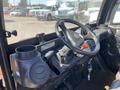 Interior view of a 2018 Kubota RTV-X 1100 C showing the steering wheel dashboard controls and cup holder