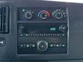 Dashboard of a 2016 GMC Savana featuring climate controls and a radio with a digital display showing the time as 6:45
