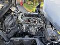 Engine of a 2014 Hino 195 with various hoses and components visible including the intake manifold and fuel system