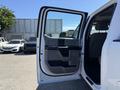 A 2017 Ford F-350 SD with its front door open showcasing the interior features and design