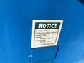 A notice label detailing tire size, pressure, lug nut torque, dry bolts, and lubricated bolts for a 1997 Genie S-65 4X4 lift.
