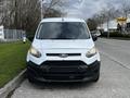 Front view of a white 2016 Ford Transit Connect with a black grille and headlights visible