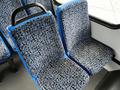 Two blue bus seats with patterned fabric in a simple and clean design