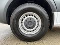 A close-up of a wheel and tire from a 2019 Mercedes-Benz Sprinter showing the tire tread and a silver wheel rim with ventilation holes