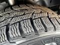 Close-up of a tire tread showing deep grooves and patterns on a 2018 Ford Transit tire