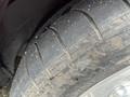 Close-up of a worn tire tread from a 1970 Chevrolet Corvette showing deep grooves and uneven wear on the rubber surface