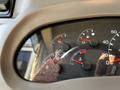 Dashboard display of a 2000 Ford Motorhome showing gauges for fuel oil temperature and engine temperature with red and white indicators