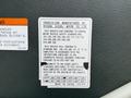 A label detailing the specifications and compliance information for a 2009 UD Trucks UD 3300 chassis-cab manufactured by Nissan Diesel Motor Co Ltd