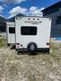 A 2014 Starcraft Launch 24RLS travel trailer with a white exterior and a spare tire mounted on the rear