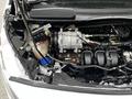 A close-up view of the engine compartment of a 2019 Ford Transit Connect showing the engine components and cooling system details