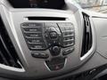 Dashboard controls of a 2017 Ford Transit featuring a central console with buttons for radio media phone sound and a digital display on top