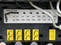 A control panel displaying specifications for a hydraulic arm with various measurements and corresponding weight capacities labeled with yellow markers