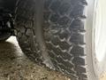 Close-up of a heavy-duty tire on a 2014 International TerraStar showcasing its tread pattern and rugged design