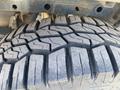 Close-up of the rugged tire tread of a 2017 Ford F-150 showing deep grooves and patterns designed for traction and off-road performance