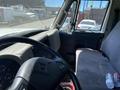 The interior of a 2014 International TerraStar featuring a steering wheel dashboard and a passenger seat