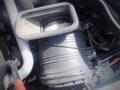 A close-up of the air filter housing from a 2012 International 7400 showing the filter element and surrounding components