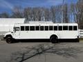 A 2022 Blue Bird Vision school bus painted in white with black wheels and windows
