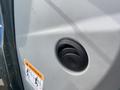 Close-up of the fuel filler cap on a 2016 New Holland T475 tractor with a warning label near it