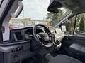 Interior view of a 2023 Ford Transit showing the steering wheel dashboard and center console