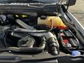 Engine compartment of a 2018 Ford F-550 showing various components including hoses battery and coolant reservoir