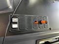 Control panel with five switches and two orange toggle switches on a 2022 Blue Bird Vision