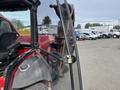 A 2012 Toro Groundsmaster 5910 with a red body and an exposed mowing deck visible from the driver's side cab