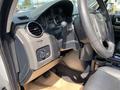 Interior view of a 2006 Land Rover LR3 showing the dashboard air vents control panel and steering wheel