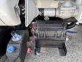 A 2015 Ford F-750 battery and mounting bracket with visible wiring connections and terminals