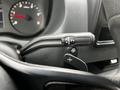 A close-up of the gear shift lever of a 2019 Mercedes-Benz Sprinter showing the drive mode options R N D and a plus sign for manual shifting