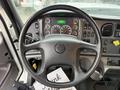 Steering wheel and dashboard of a 2016 Freightliner 108SD displaying various gauges and controls