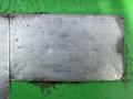 A metal identification plate attached to a 1996 Kenworth T800 detailing safety information and manufacturer details