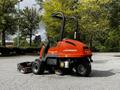 A 2015 Jacobsen Eclipse lawn mower with a bright orange body and a flat cutting deck in the foreground