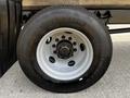 Close-up of a Michelin tire mounted on the rim of a 2019 International 4300 showing tread and lug nuts