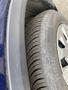 A close-up of a 2019 Nissan Rogue tire showing tread patterns and a metallic wheel rim
