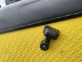 Close-up of a gear shift lever on a yellow textured surface of a 2000 Ez-go Industrial 800 golf cart