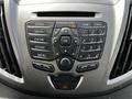 Dashboard controls of a 2018 Ford Transit featuring buttons for radio media phone sound menu and a numeric keypad